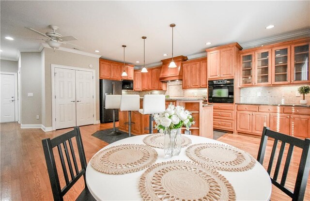 55 Little Barley Ln, Grayson, GA 30017 - dining space with ornamental molding, recessed lighting, light wood-style floors, baseboards, and ceiling fan