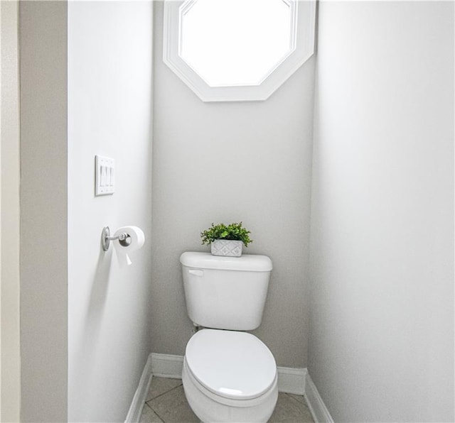 55 Little Barley Ln, Grayson, GA 30017 - bathroom with baseboards, toilet, and tile patterned flooring