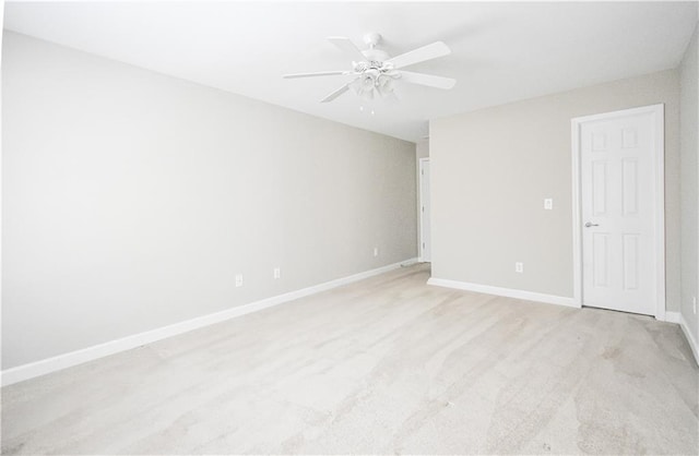 55 Little Barley Ln, Grayson, GA 30017 - spare room featuring light carpet, baseboards, and a ceiling fan