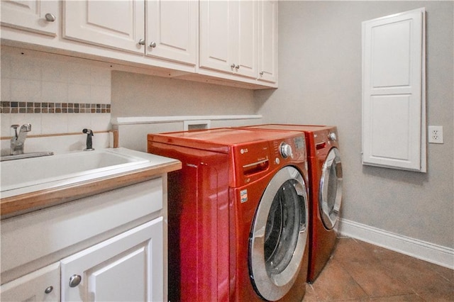 55 Little Barley Ln, Grayson, GA 30017 - clothes washing area with baseboards, cabinet space, separate washer and dryer, and tile patterned floors