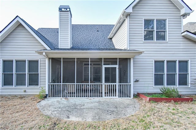 55 Little Barley Ln, Grayson, GA 30017 - back of house featuring a sunroom, a chimney, a patio, and roof with shingles