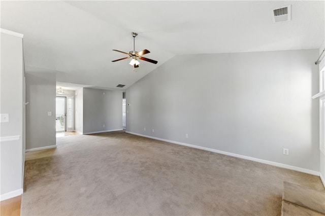 unfurnished living room with light carpet, visible vents, baseboards, vaulted ceiling, and a ceiling fan