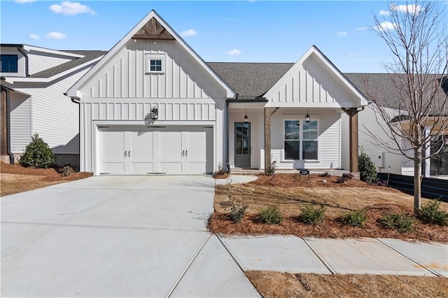 modern inspired farmhouse with a garage