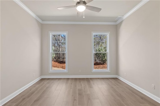 empty room with light wood-type flooring, a healthy amount of sunlight, and crown molding