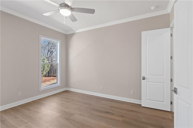 unfurnished room with ceiling fan, ornamental molding, and light hardwood / wood-style floors