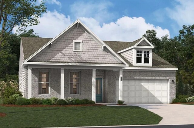 view of front facade featuring a garage, driveway, brick siding, and a front yard