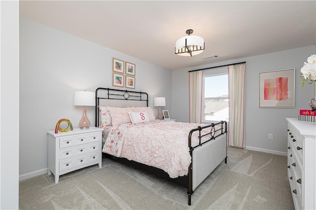 bedroom featuring light carpet, visible vents, and baseboards