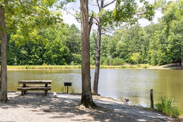 surrounding community with a water view