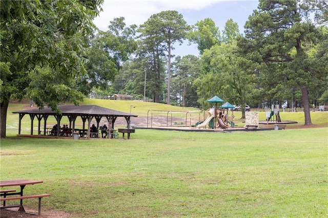 view of property's community with playground community, a yard, and a gazebo