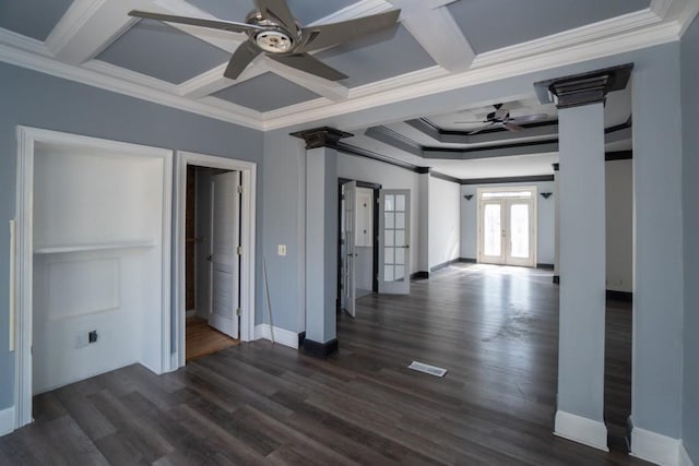 spare room with french doors, coffered ceiling, and decorative columns