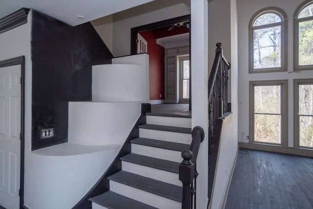 stairs with wood finished floors