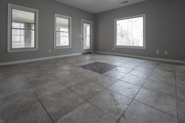 tiled foyer entrance featuring visible vents and baseboards