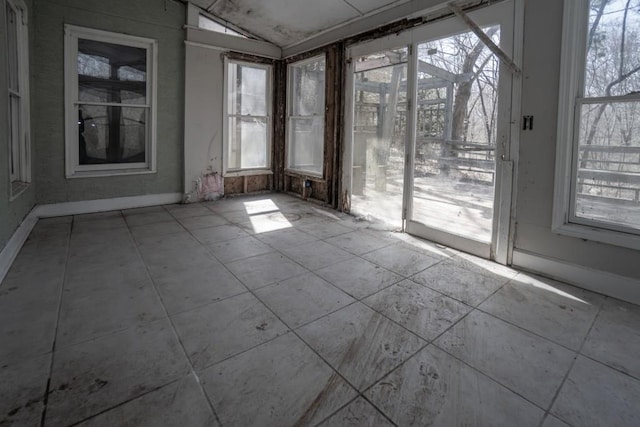 spare room featuring lofted ceiling