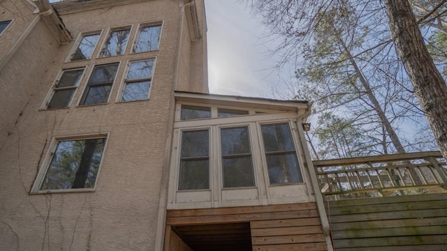 view of property exterior with stucco siding