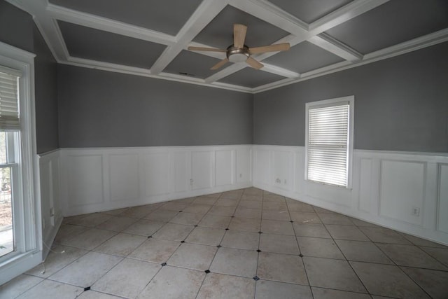 spare room featuring light tile patterned floors, a ceiling fan, and coffered ceiling