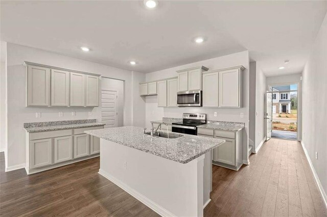 339 Elgin Dr, Lawrenceville, GA 30045 - kitchen featuring dark wood-type flooring, baseboards, stainless steel appliances, and a sink