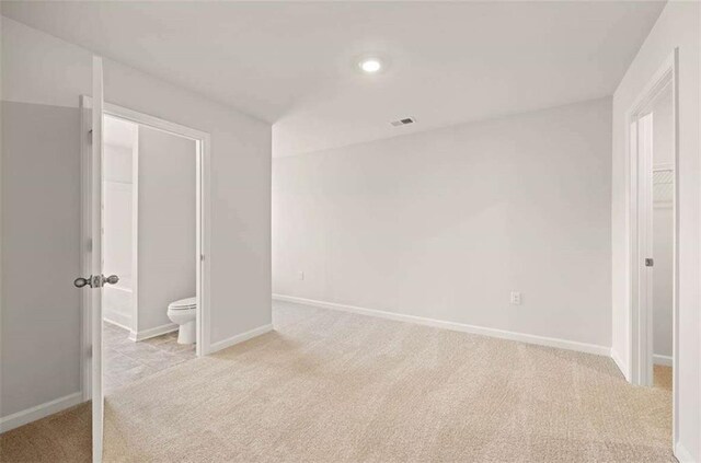 339 Elgin Dr, Lawrenceville, GA 30045 - unfurnished bedroom with recessed lighting, visible vents, light carpet, ensuite bath, and baseboards