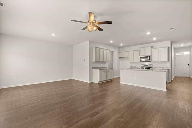 339 Elgin Dr, Lawrenceville, GA 30045 - unfurnished living room with ceiling fan, baseboards, dark wood-type flooring, visible vents, and recessed lighting