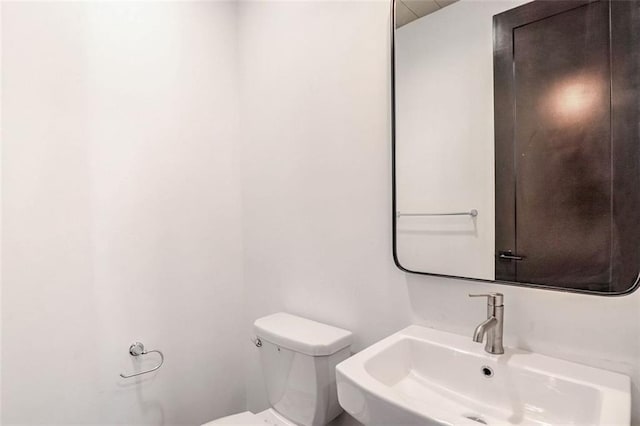 bathroom with sink and toilet