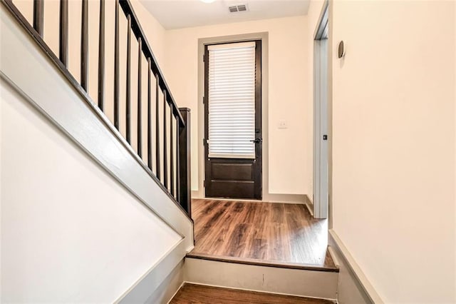 foyer featuring dark wood-type flooring