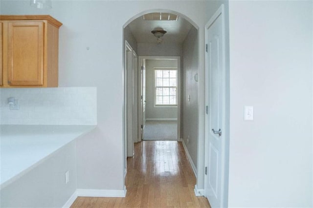 hall with light wood-type flooring