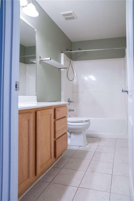 full bathroom with vanity, toilet, shower / bath combination, and tile patterned flooring