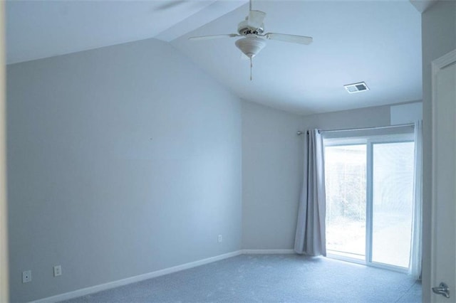 carpeted empty room featuring ceiling fan and vaulted ceiling