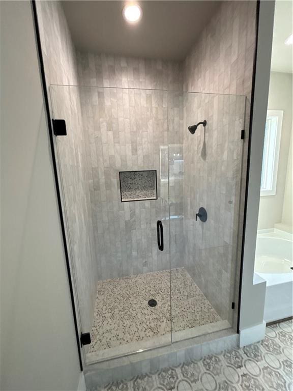 bathroom featuring tile patterned floors and plus walk in shower