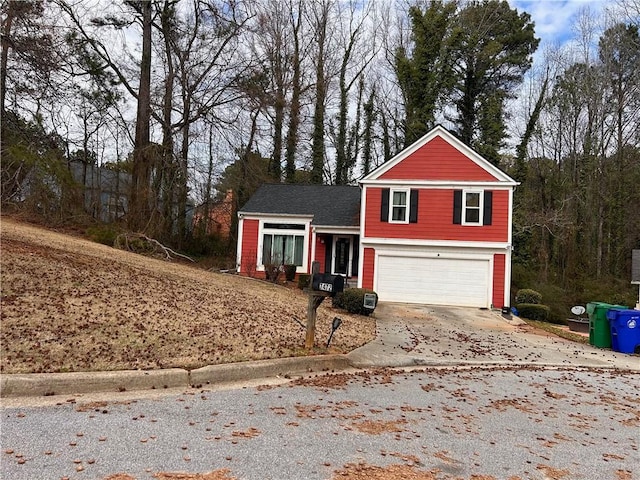 tri-level home with a garage and driveway