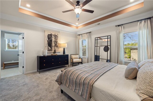 carpeted bedroom featuring ceiling fan, multiple windows, and crown molding