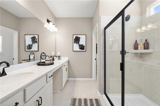 bathroom with vanity, tile patterned floors, and a shower with door