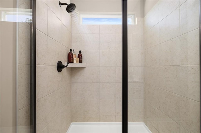 bathroom with tiled shower