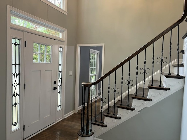 730 Redlion Run, Alpharetta, GA 30022 - foyer entrance with wood finished floors, plenty of natural light, a high ceiling, stairway, and baseboards