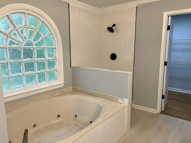 730 Redlion Run, Alpharetta, GA 30022 - full bathroom with a jetted tub, a tile shower, crown molding, a walk in closet, and baseboards
