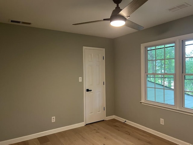 730 Redlion Run, Alpharetta, GA 30022 - empty room featuring a ceiling fan, light wood finished floors, and baseboards
