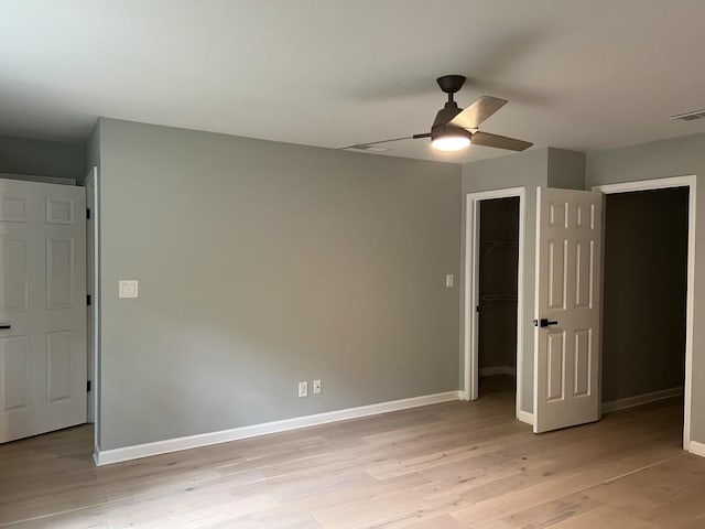 730 Redlion Run, Alpharetta, GA 30022 - unfurnished bedroom with light wood-style flooring, baseboards, a closet, a spacious closet, and ceiling fan