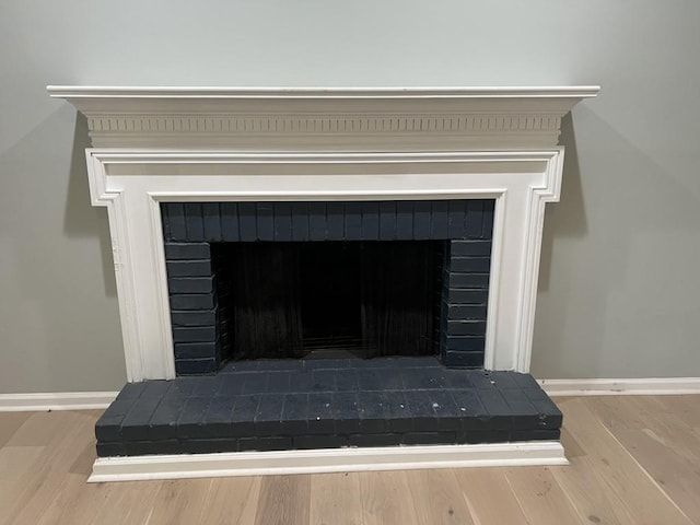 730 Redlion Run, Alpharetta, GA 30022 - detailed view of a fireplace with raised hearth, baseboards, and wood finished floors