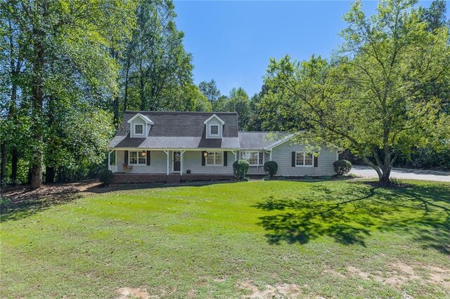 view of front of house with a front lawn and a porch