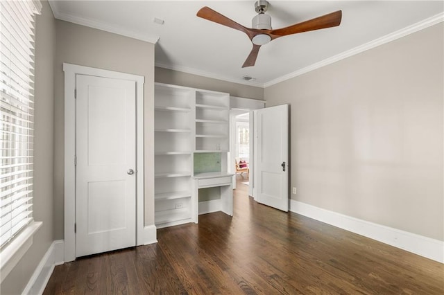 unfurnished bedroom featuring baseboards, ornamental molding, a ceiling fan, and dark wood-style floors