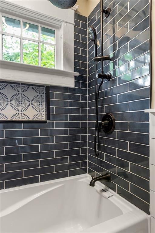 bathroom featuring washtub / shower combination
