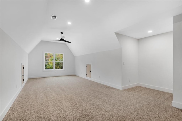 bonus room featuring light colored carpet, lofted ceiling, and ceiling fan