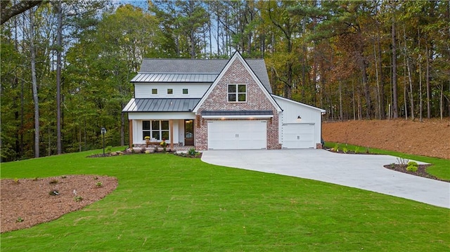 view of front of property with a garage and a front lawn