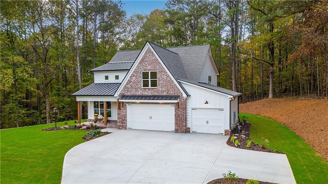 view of front of home featuring a garage and a front yard