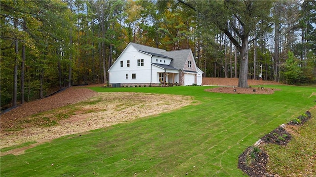 exterior space featuring a garage and a lawn