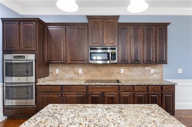 kitchen featuring dark wood-style floors, dark brown cabinets, appliances with stainless steel finishes, and ornamental molding