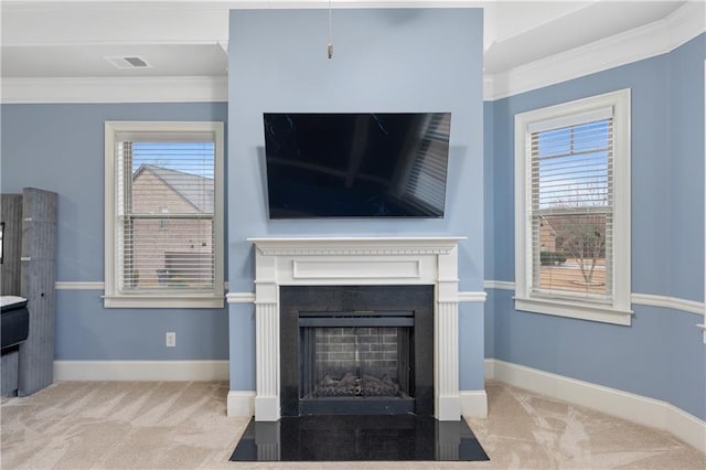 living room with crown molding, a fireplace with flush hearth, baseboards, and carpet floors