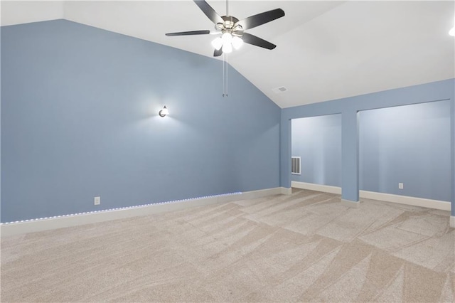 additional living space featuring visible vents, baseboards, and vaulted ceiling