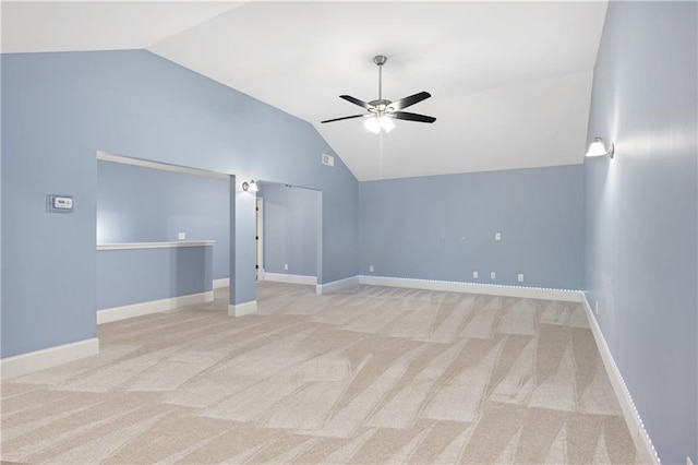 additional living space with vaulted ceiling, a ceiling fan, baseboards, and carpet floors