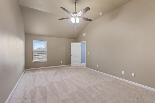 unfurnished room with high vaulted ceiling, a ceiling fan, baseboards, and light carpet