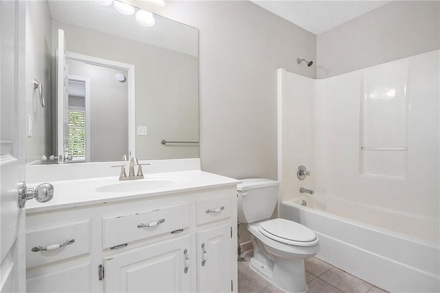 bathroom featuring toilet, tile patterned floors, bathtub / shower combination, and vanity